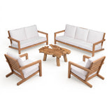 Teak Warehouse Granada A-grade teak outdoor sofa set with white cushions and a natural live-edge wood coffee table.
