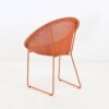 metro outdoor wicker dining chair orange back angle view