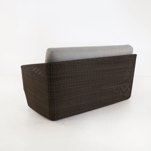back view of brown wicker sofa