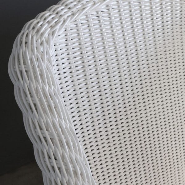 white wicker outdoor dining chair closeup image