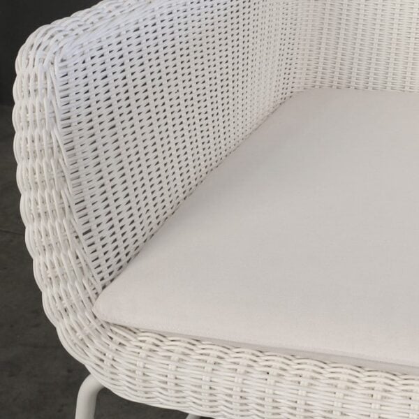 white wicker outdoor arm chair closeup image