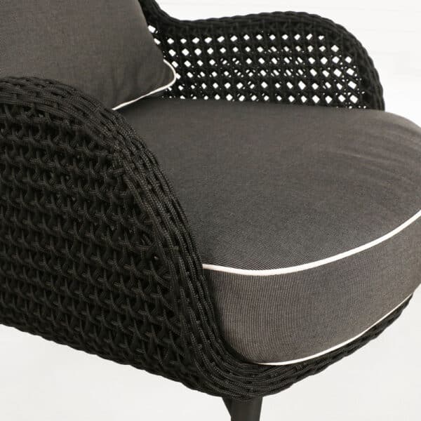 dream high back outdoor relaxing wicker chair black cushions closeup